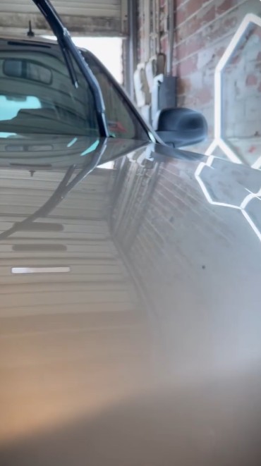 Vehicle after paintless dent repair — factory finish restored — set 5