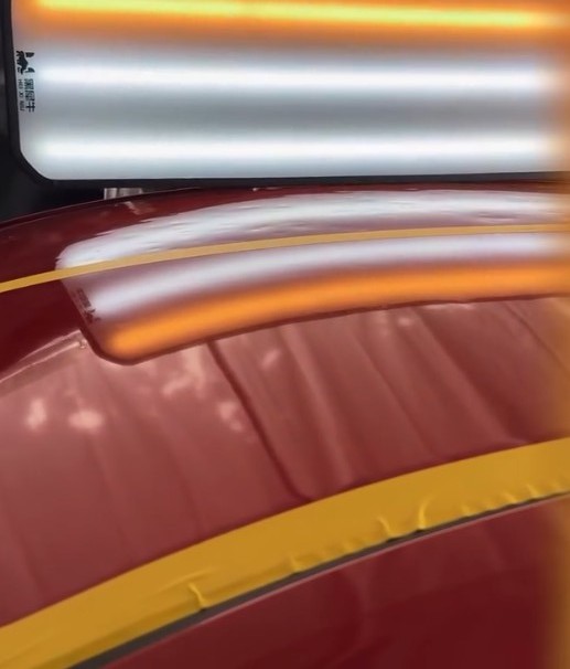 Vehicle after paintless dent repair — factory finish restored — set 6