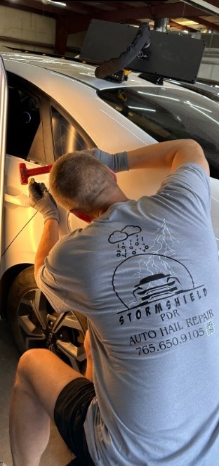 StormShield PDR paintless dent repair technician
