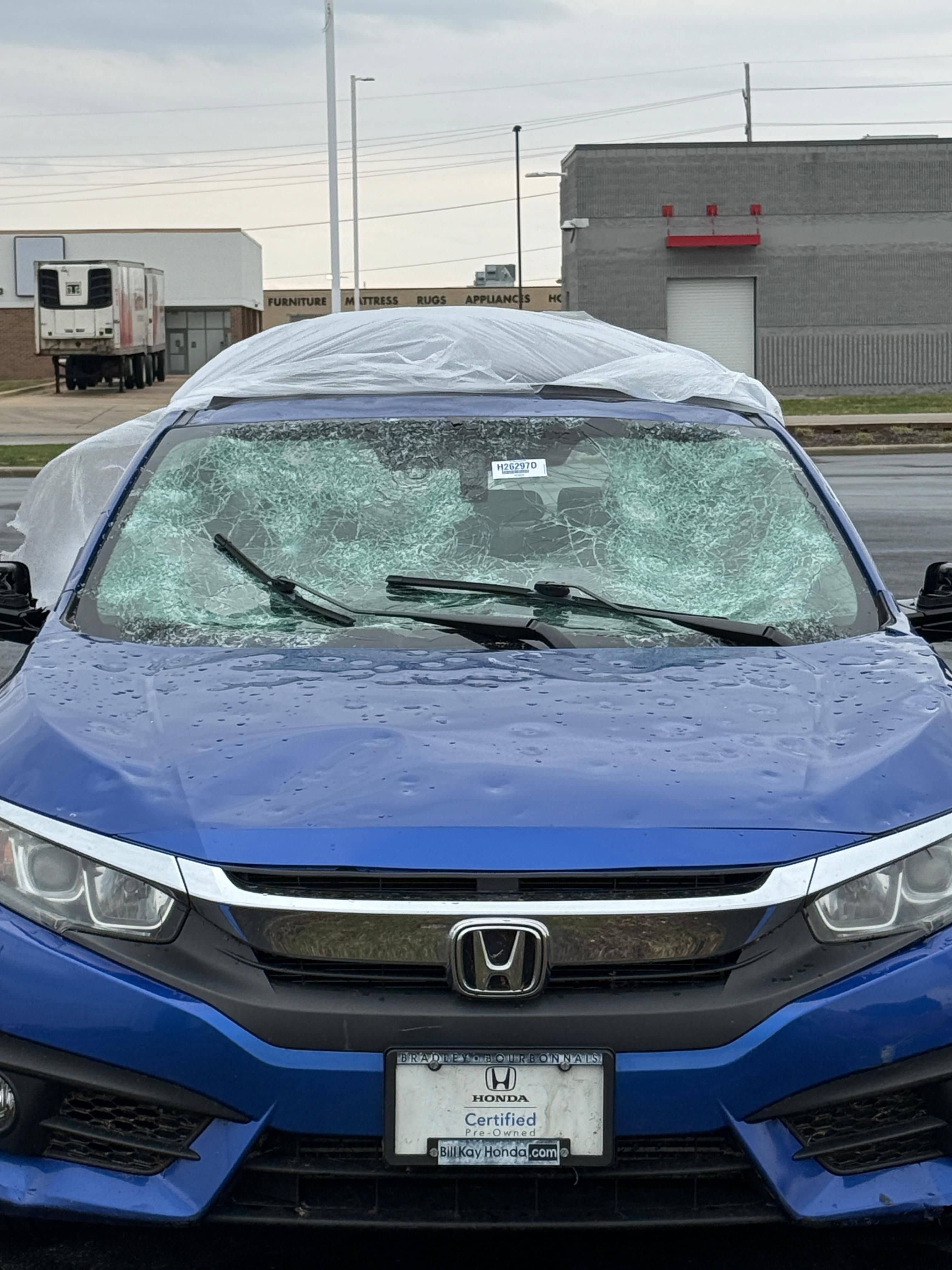 Hail damage on vehicle hood